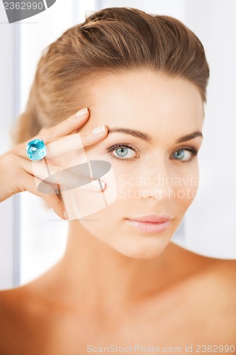Image of woman with one jewelry ring