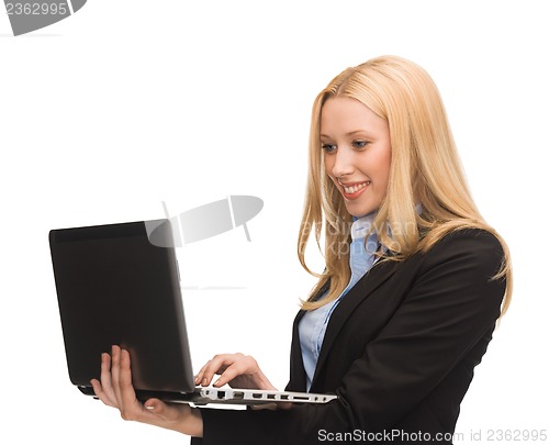 Image of smiling woman with laptop computer