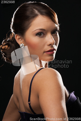 Image of woman with diamond earrings