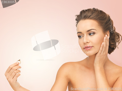 Image of woman with wedding ring