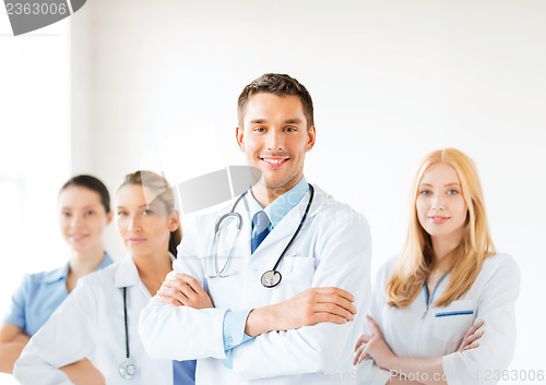 Image of male doctor in front of medical group