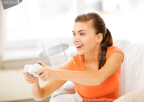 Image of woman with joystick playing video games