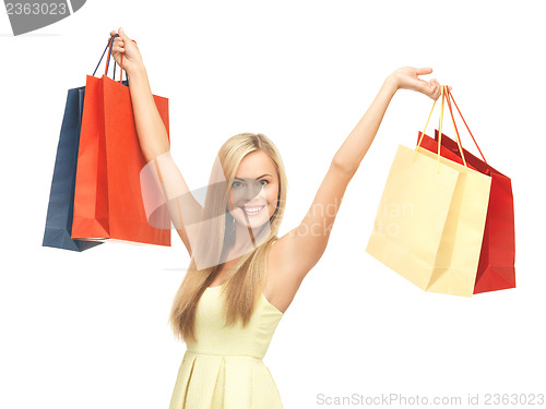 Image of excited woman with shopping bags