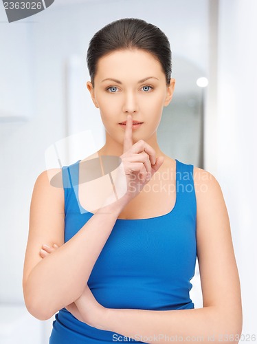 Image of woman making a hush gesture