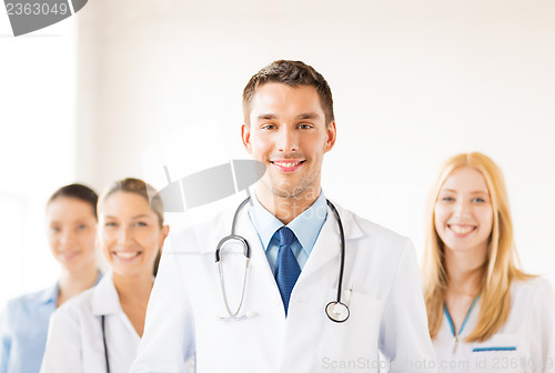 Image of male doctor in front of medical group