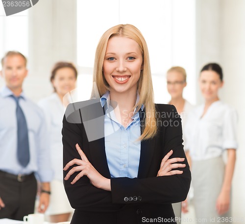 Image of smiling businesswoman in office