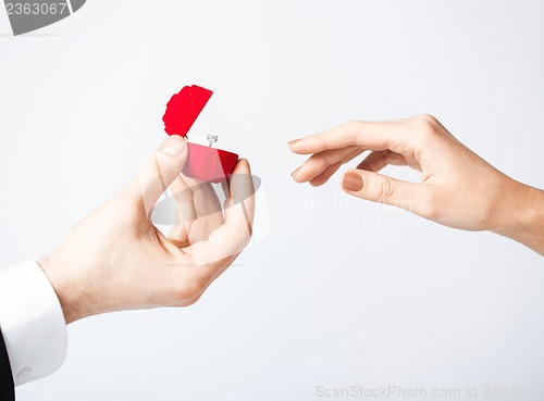 Image of couple with wedding ring and gift box