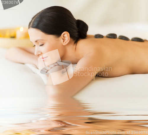 Image of woman in spa with hot stones