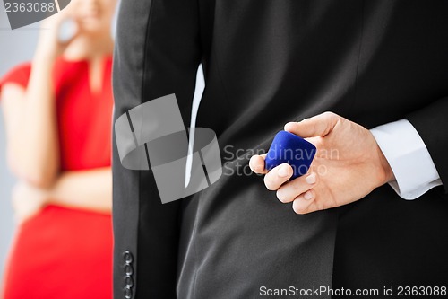 Image of man with wedding ring and gift box