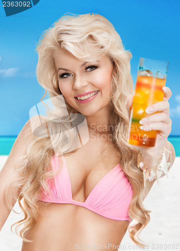 Image of woman in bikini with cocktail