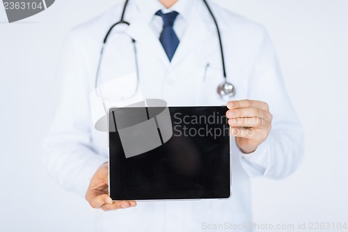 Image of male doctor holding tablet pc