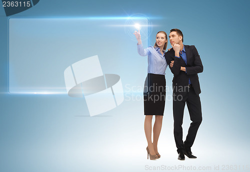 Image of man and woman working with virtual screen