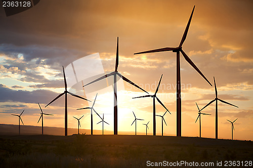 Image of wind turbines on sunset sky