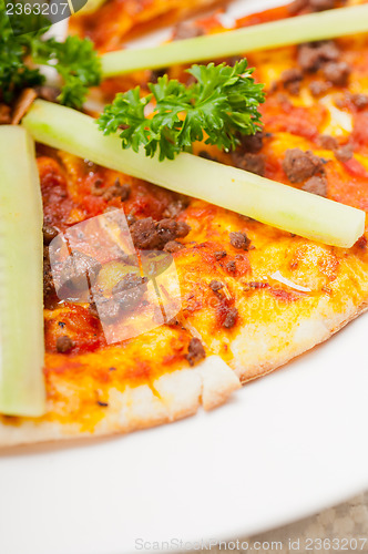 Image of Turkish beef pizza with cucumber on top