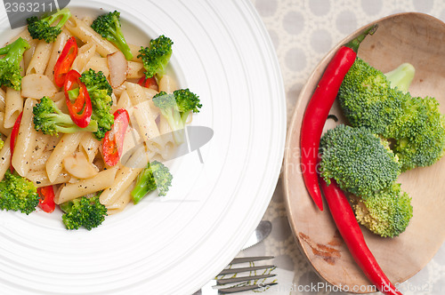 Image of Italian penne pasta with broccoli and chili pepper