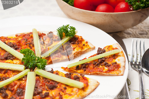 Image of Turkish beef pizza with cucumber on top