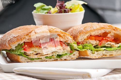 Image of ciabatta panini sandwich with chicken and tomato