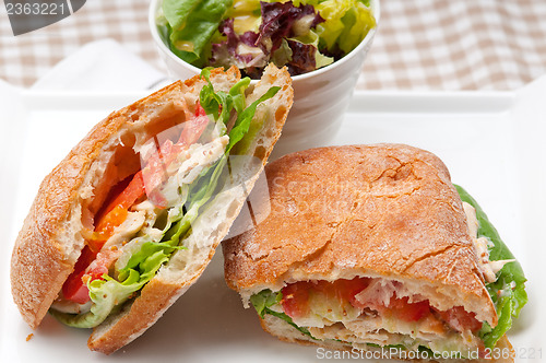 Image of ciabatta panini sandwich with chicken and tomato