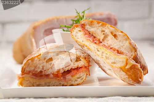 Image of ciabatta panini sandwich with parma ham and tomato