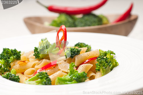 Image of Italian penne pasta with broccoli and chili pepper