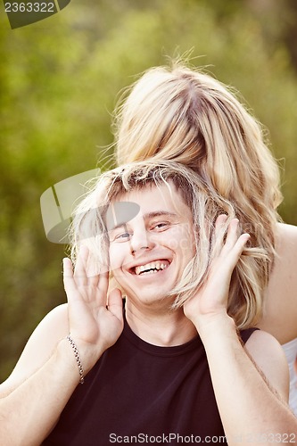 Image of Man trying on long hair