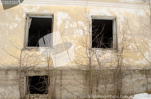 Image of abandoned masonry brick house wall broken windows 