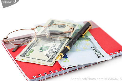 Image of Pen, spectacles, dollar, euro