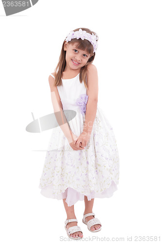 Image of smiling little girl in white dress 