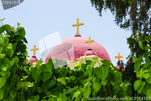 Image of Christian orthodox church in natural foliage frame