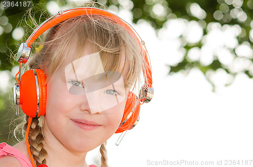 Image of Closeup portrait of cheerful girl listening lesson