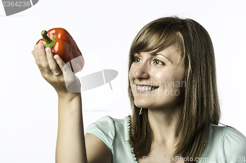 Image of Young woman looks at papper