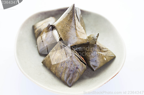 Image of Stuffed dough pyramid dessert on plate