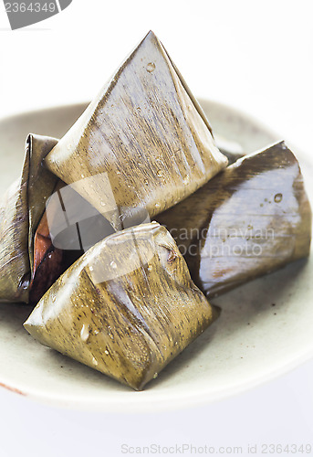 Image of Stuffed dough pyramid dessert on dish