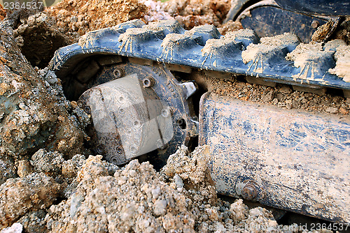 Image of Closeup of digger's tracks in mud