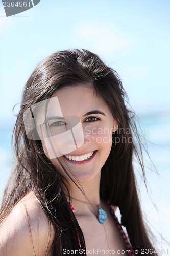 Image of Beautiful brunette at the seaside