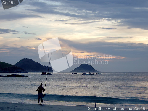 Image of Fishing on the sunset at the beach