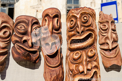 Image of wooden carved funny masks spring fair rural crafts 