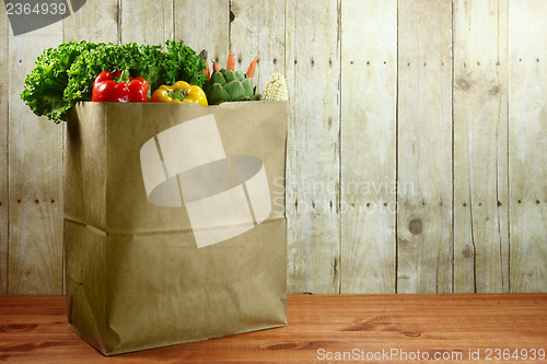 Image of Bag of Grocery Produce Items on a Wooden Plank