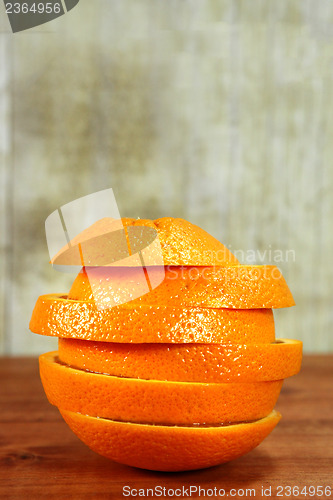 Image of Fruit Sliced Sitting on a Wooden Surface