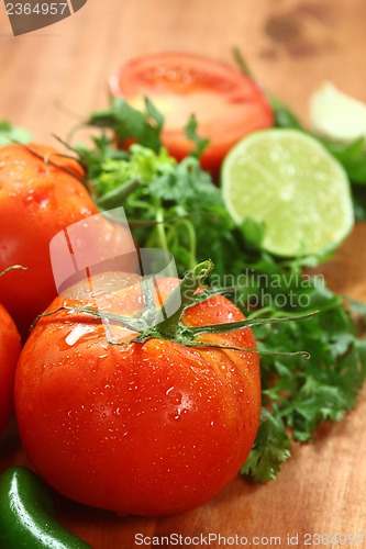 Image of Tomatoes on a Rustic Wood Plank