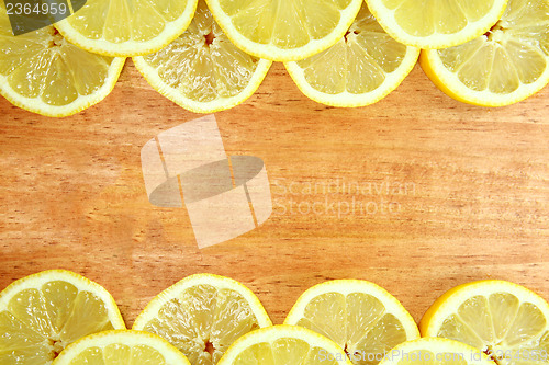 Image of Fruit Sliced Sitting on a Wooden Surface