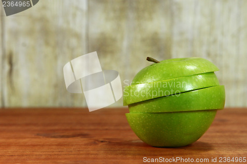 Image of Fruit Sliced Sitting on a Wooden Surface