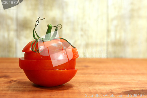 Image of Tomatoes on a Rustic Wood Plank