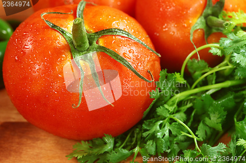 Image of Tomatoes on a Rustic Wood Plank