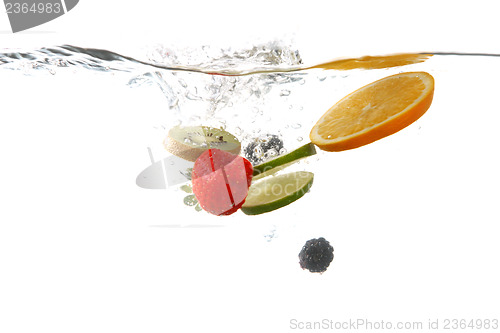 Image of Fruits Falling Into Splashing Clear Water