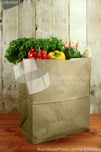 Image of Bag of Grocery Produce Items on a Wooden Plank