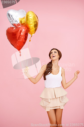 Image of Cute brunette with balloons