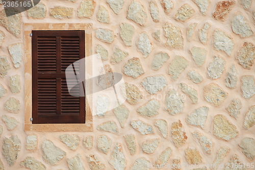 Image of Window with closed wooden shutters