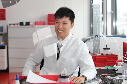 Image of Smiling Asian laboratory technician