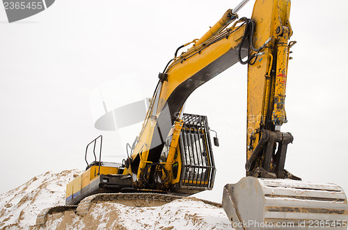 Image of excavator quarry sand pit snow winter industry 